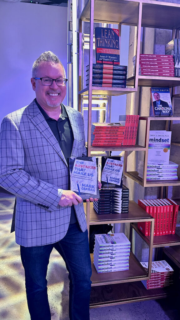 Mark Graban with his book, The Mistakes That Make Us: Cultivating a Culture of Learning and Innovation 